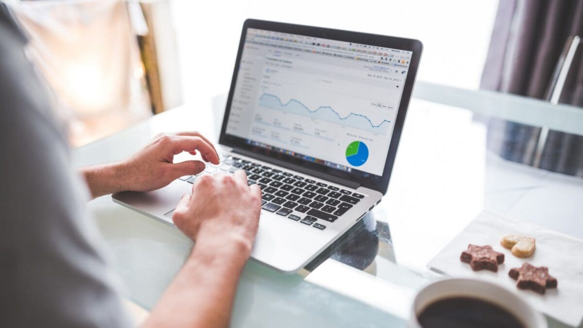 A marketer looking at Google Ads data on a laptop screen